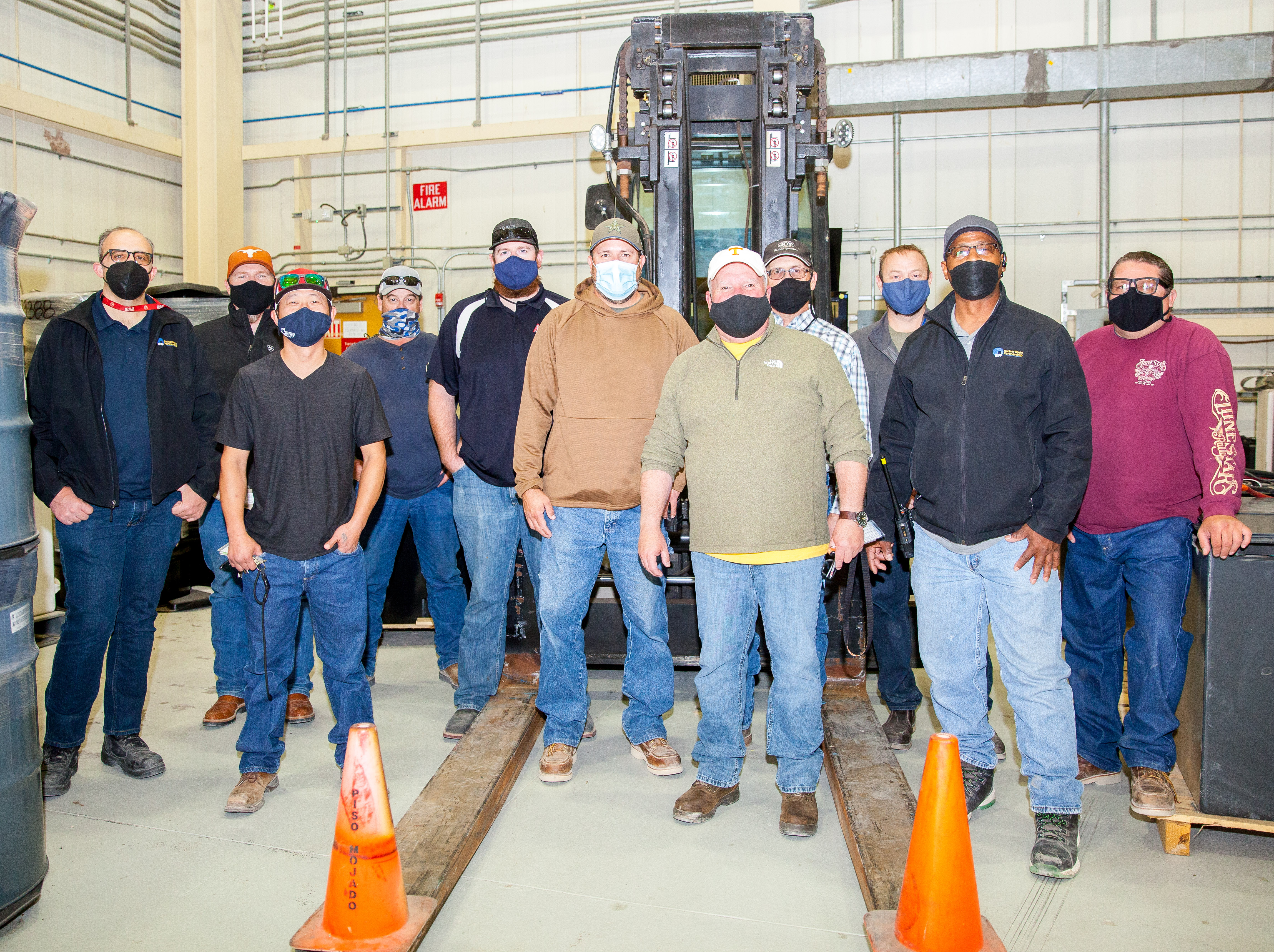 Members of the Engineering and Maintenance crew that solved the issue of charging the forklift batteries